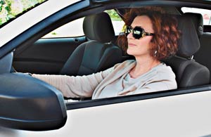 Adult female driver with sunglasses